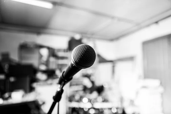 Black and white microphone on a band rehearsal garage (music)