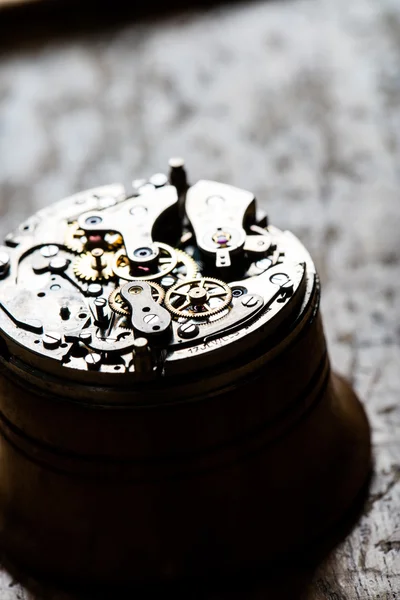 Fascinating antique watch mechanism on repair table