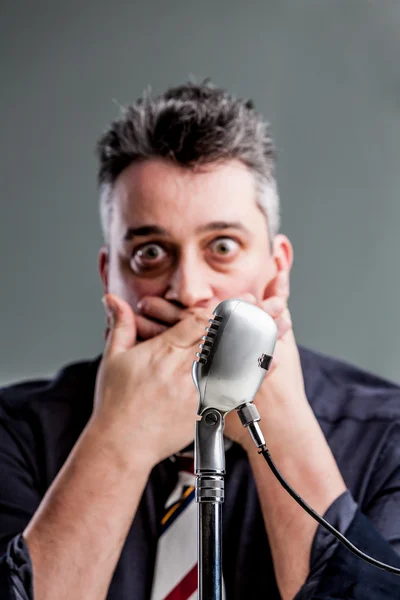 Man scared to speak on the microphone