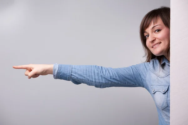 Girl pointing out with her entire arm