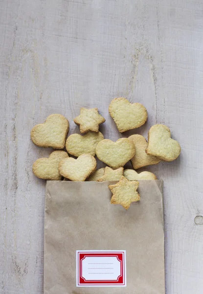 Biscuits in a packet on a light wooden background