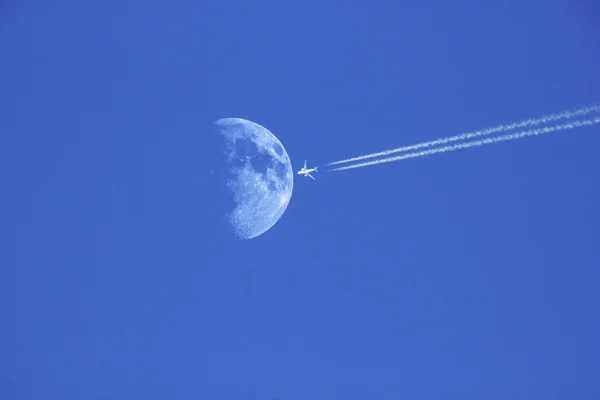 Jet plane and Moon