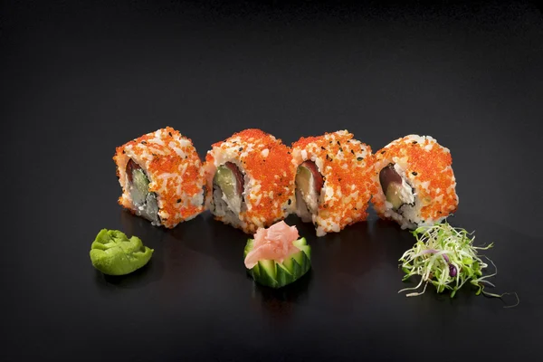 Delicious Sushi set.Uramaki sushi rolls decorated with caviar