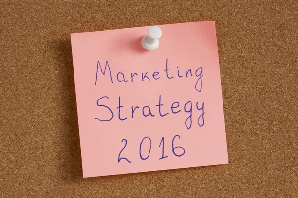 Sticky note with text marketing strategy 2016