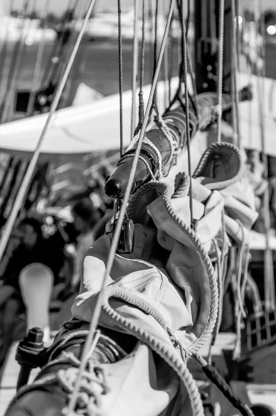 Vintage sailing yacht close up of equipment, black and white, vertical frame