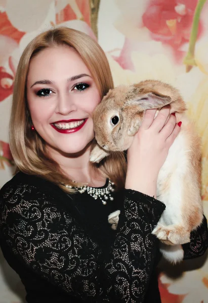 Girl and pygmy rabbit