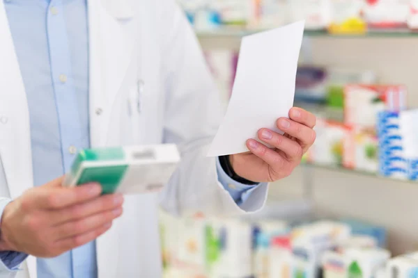 Pharmacist filling prescription