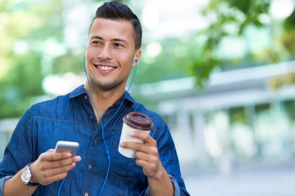 Man listening to music on mobile phone