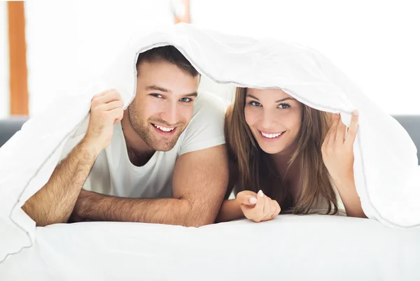 Couple under bed covers