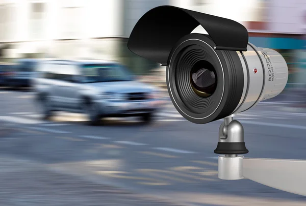 Close-up of a security camera in city traffic