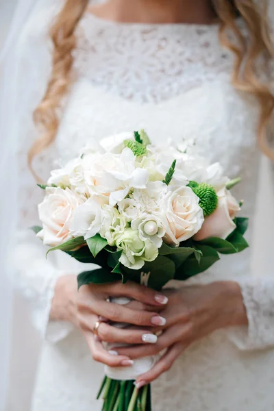 Nice wedding bouquet in brides hand