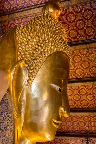 Reclining big Buddha gold statue