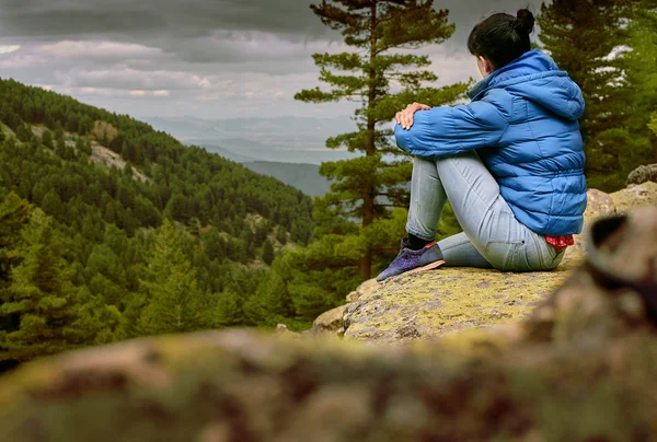 Woman hiking around mountains and having relax with beautiful landscape view - Hard way to the top concept