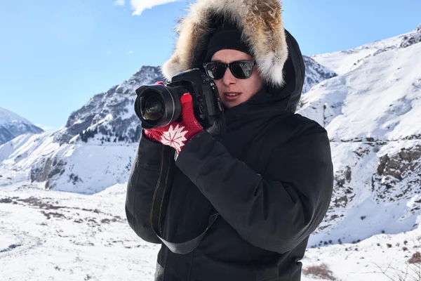 Travel photographer in polar jacket