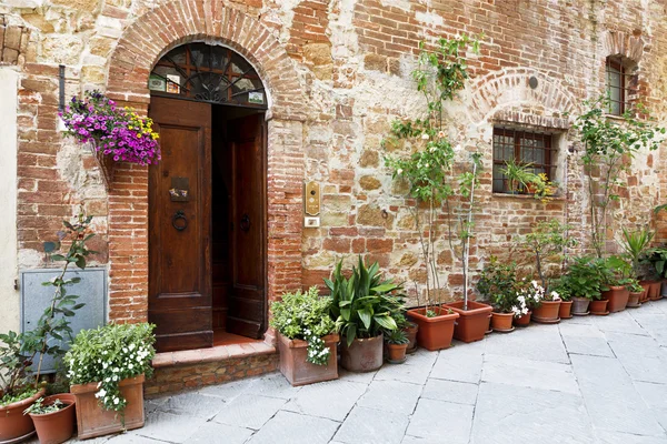 The cobbled streets of the beautifully decorated walls with colorful flowers