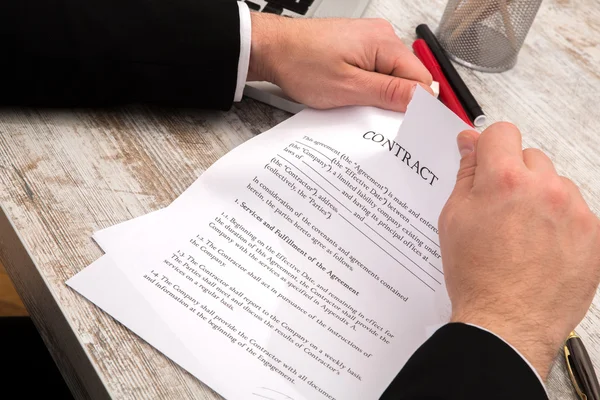 A businessman signing a Contract