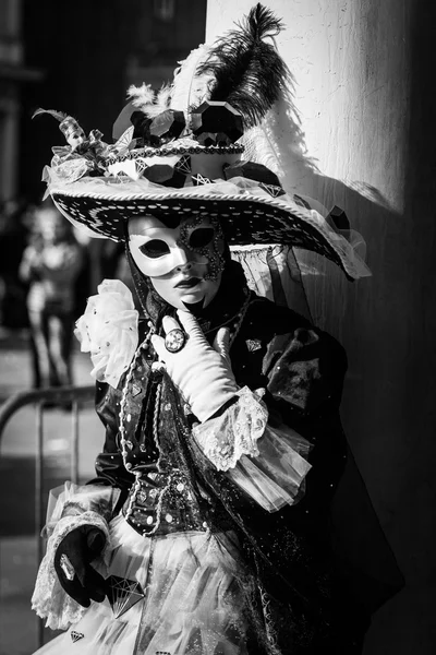 Venice - February 6, 2016: Carnival mask through the streets of  Venice