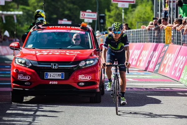 Risoul, France May 27, 2016; Professional Cyclist exhausted passes the finish line after a hard mountain stage