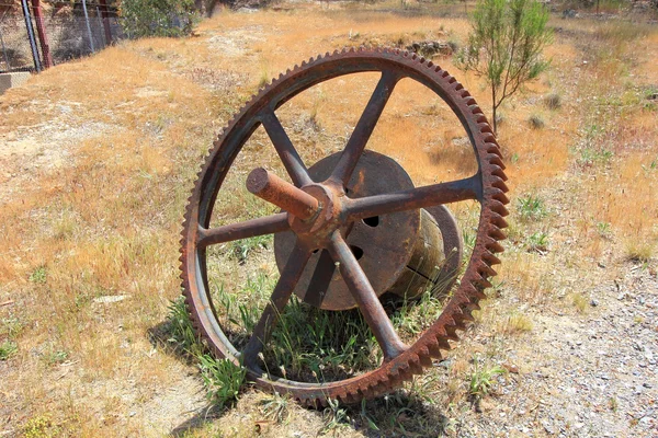 Old and rusting giant wheel cog