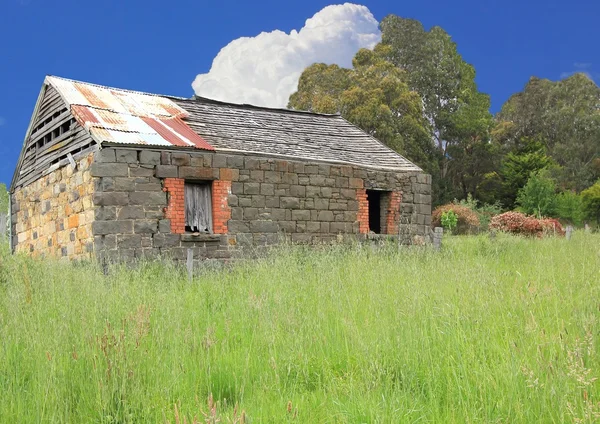 Old Australian settlers blue stone homestead in country setting