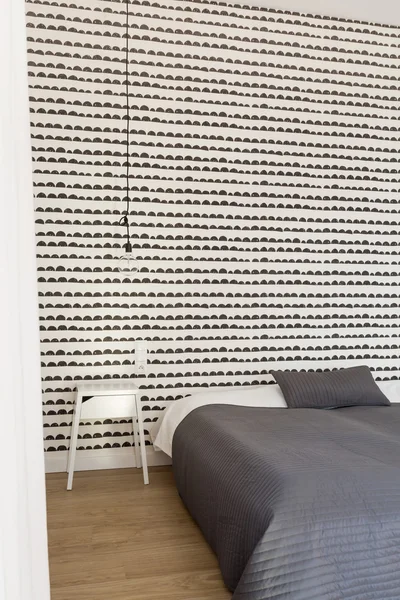 Bedroom with fancy wallpaper