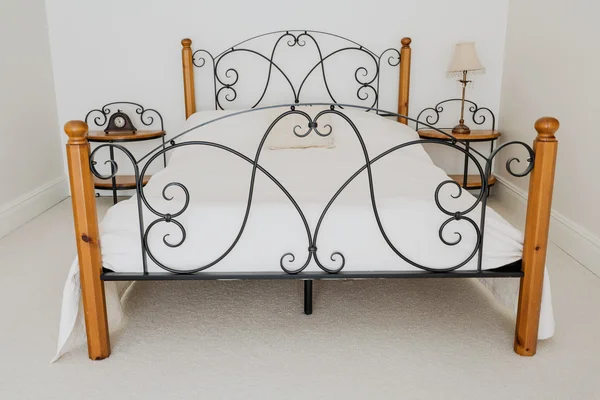 Elegant wooden and metal bed