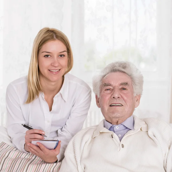 Happy old male and nice nurse