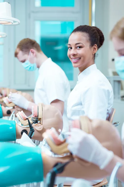 Future dentists working on phantoms