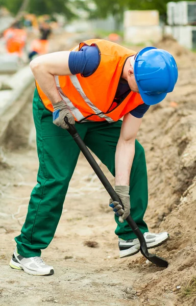 Man digging at work zone