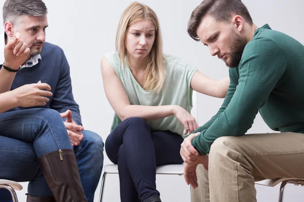 People supporting each other on psychotherapy session