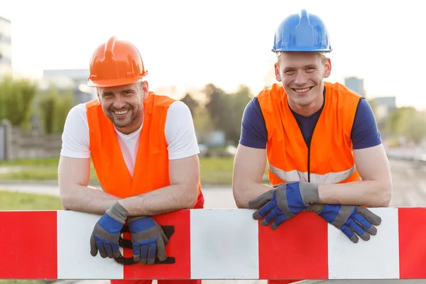 Happy smiling construction workers