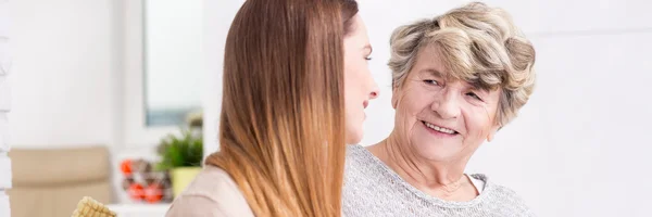 Woman meeting her grandmother at home