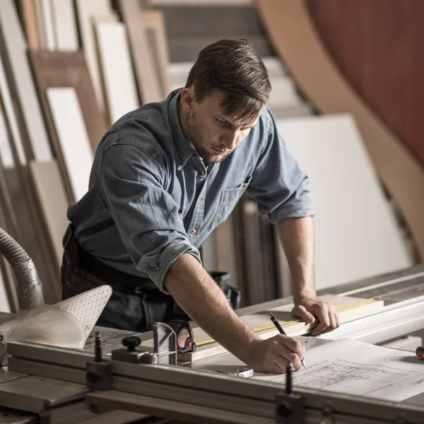 Skilled carpenter working with precision