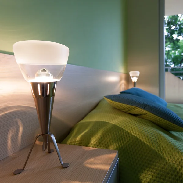 Green bedroom with modern lamps