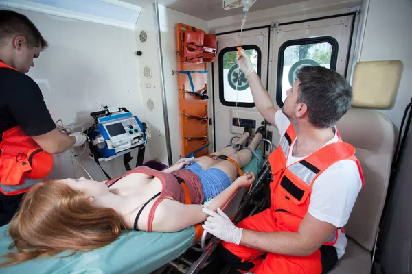 Injured woman and paramedics