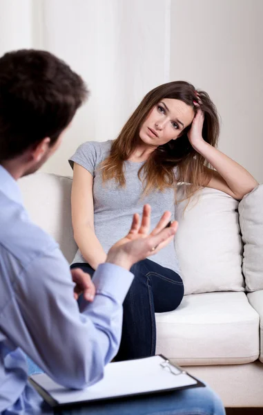 Therapist talking with his patient