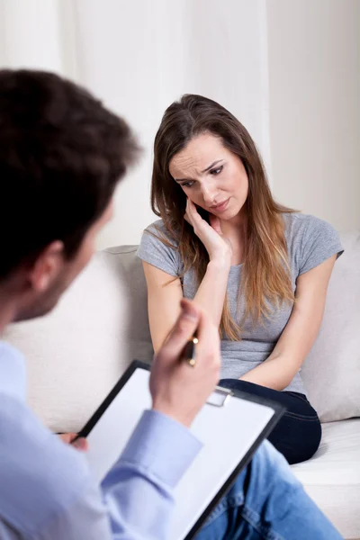 Psychotherapist listening about patient problems