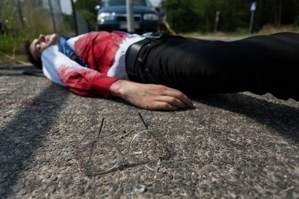 Dead man lying on the street