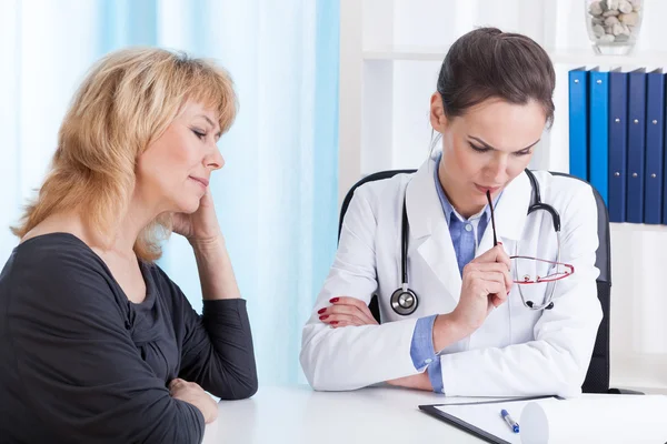 Doctor analyzing problem of her patient