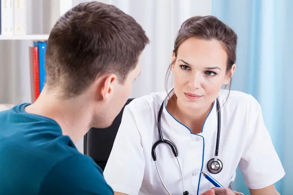 Man having medical consultation