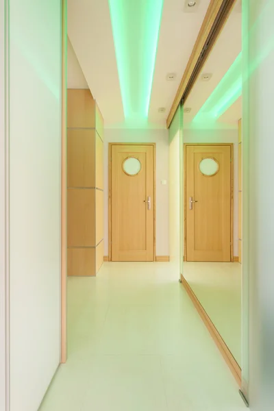Long hallway with green lightning