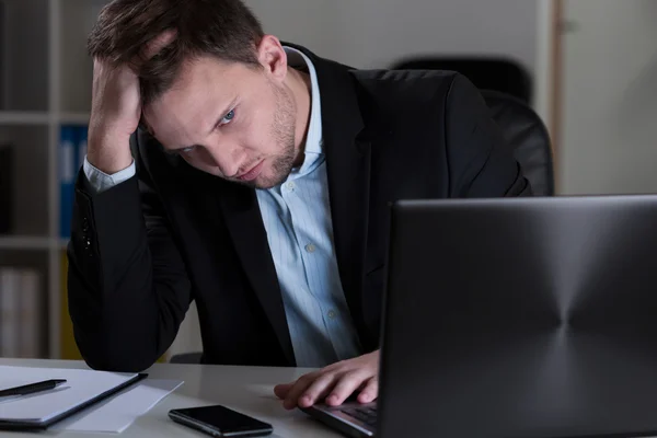 Tired man in office