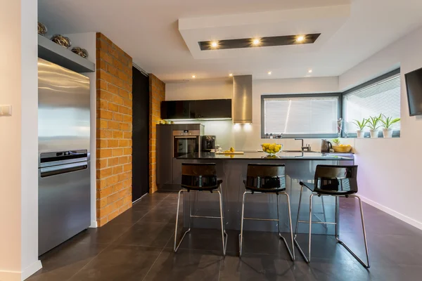 Brick wall in contemporary kitchen