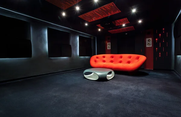 Red sofa in dark room