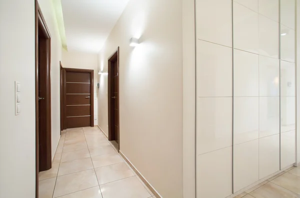 Long anteroom inside bright apartment