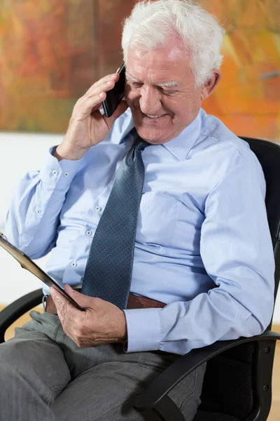 Elder man talking on phone