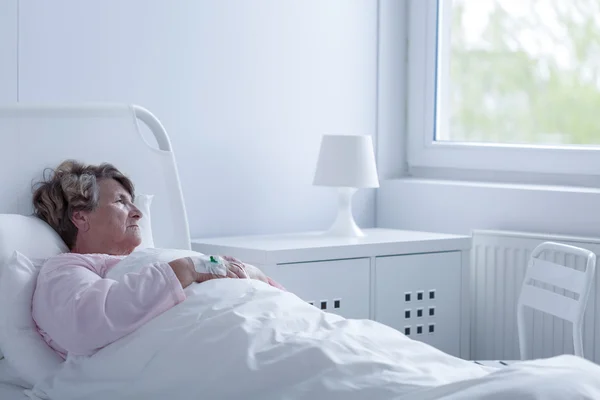 Senior woman resting in bed