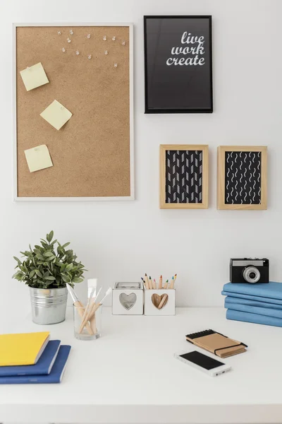 Organized materials on white desk