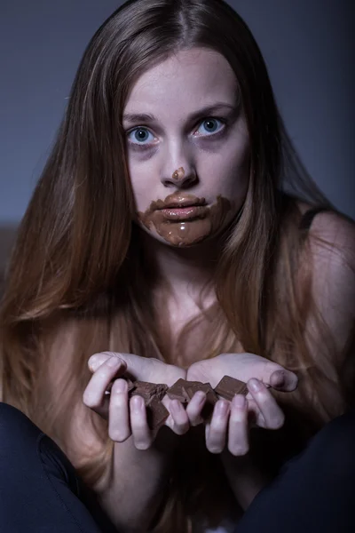 Hungry girl and chocolate