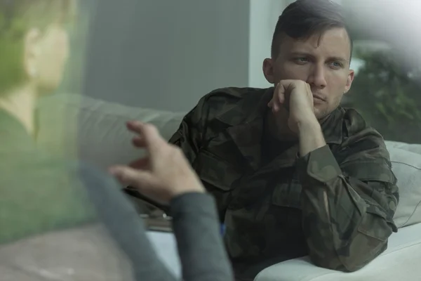 Despair soldier receiving psychological advice